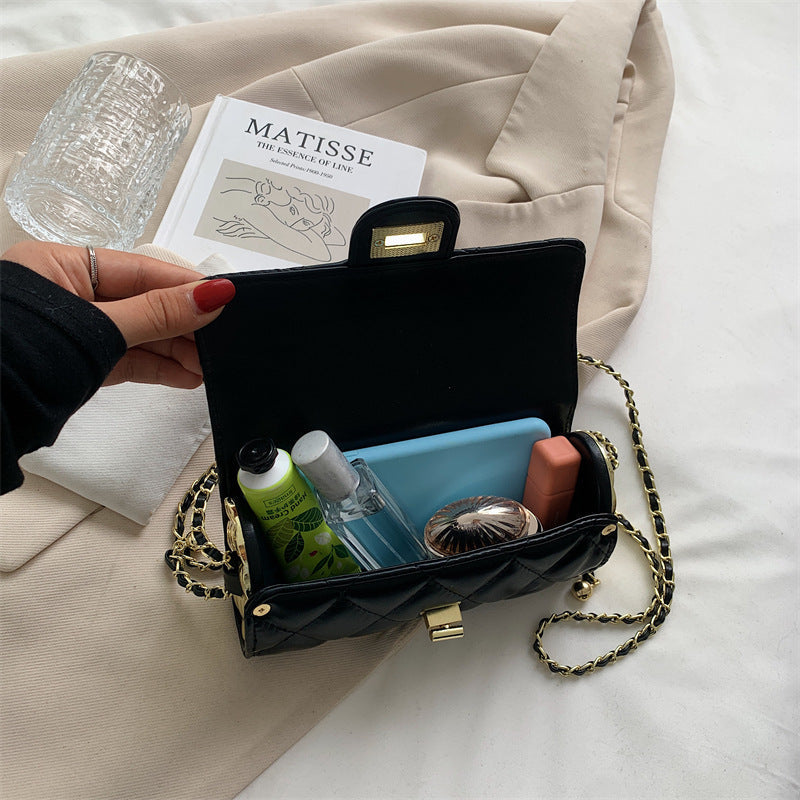 Cylindrisk vadderad väska